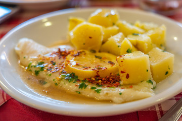 Close up photo of Italian white fish with lemon sauce