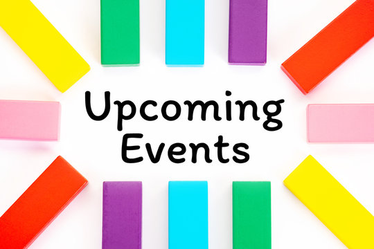 Upcoming Events written on a white paper with a colorful wooden blocks toys to remind you and important appointment.