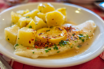 Delicious Italian cuisine white fish with lemon butter sauce