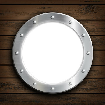 Window round ship porthole on a wooden wall