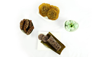 flat lay of Kue jajanan pasar or market snack cakes isolated in white
