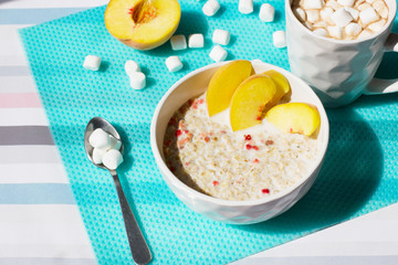 Healthy breakfast. Cereals with milk and fruits.