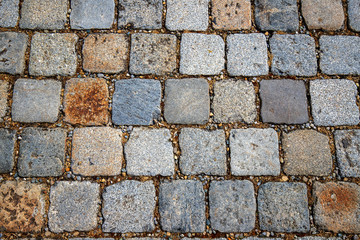 Stone pavement texture. Granite cobblestoned abstract background. Horizontal. Close-up