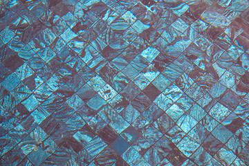 Under the water on swimming pool with mosaic mosaic tile