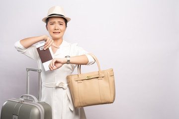Tourist woman checking time at wrist watch isolated on background