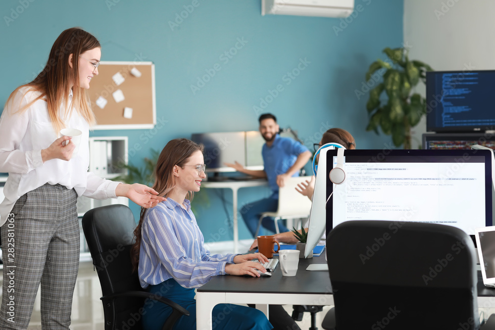Aufkleber team of programmers working in office