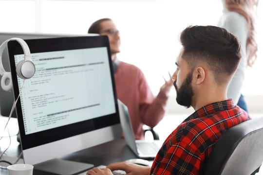 Male programmer working in office