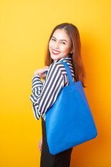 Beautiful woman is holding blue cloth bag , Save world Concept