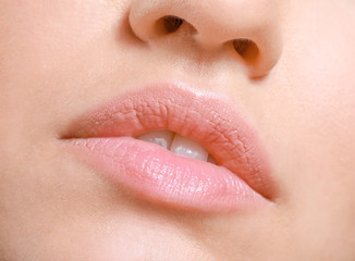 Fototapeta premium Young woman with beautiful lips, closeup