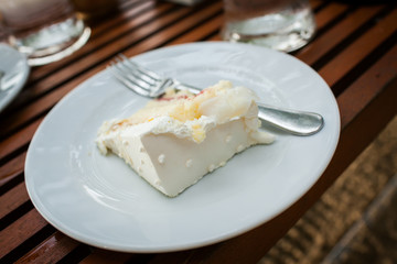 The wedding cake is cut into pieces.