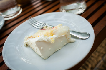 The wedding cake is cut into pieces.