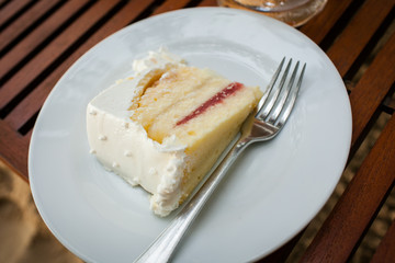 The wedding cake is cut into pieces.