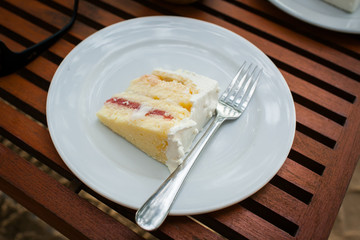 The wedding cake is cut into pieces.