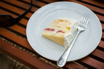 The wedding cake is cut into pieces.