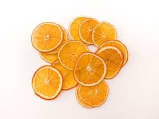 Orange fruit chips on white background. 