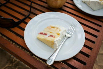 The wedding cake is cut into pieces.