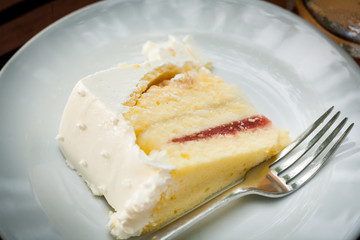 The wedding cake is cut into pieces.