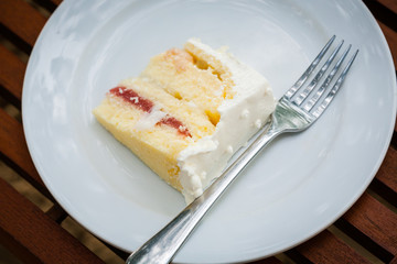 The wedding cake is cut into pieces.