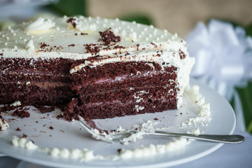 The wedding cake is cut into pieces.