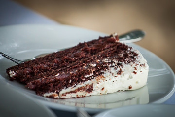 The wedding cake is cut into pieces.
