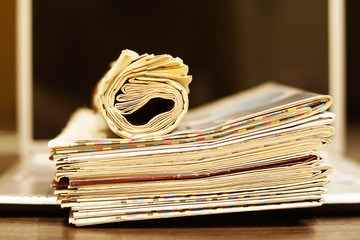 Newspapers and Laptop. Different Concepts for News - Social Network or Traditional Tabloid Journals. Data Sources - Electronic Screen of Computer or Paper Pages of Magazines, Internet or Papers