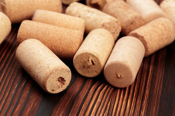 wine corks on a dark wooden background texture with a place for text.  - Image
