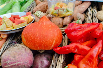 Large assortment of seasonal fruits and vegetables sold at farmers market