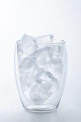 glass of ice isolated on white background