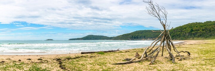 Log TeePee On a Sandy Beach Panorama