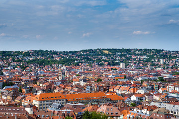 Naklejka na ściany i meble Germany, Skyline of city stuttgart in valley surrounded by hills covered by trees