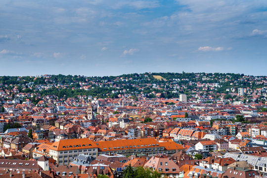 Germany, Skyline of city stuttgart in valley surrounded by hills covered by trees