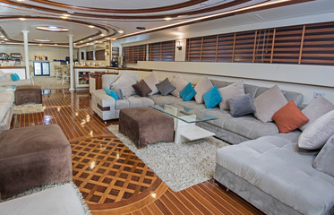 Interior of large salon area of luxury motor yacht - obrazy, fototapety, plakaty