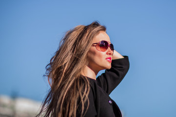 confident business woman on a blue background