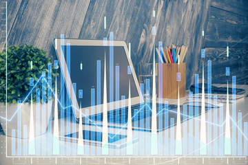 Double exposure of chart and financial info and work space with computer background. Concept of...