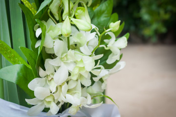 Floral arrangement at a wedding ceremony on beach.