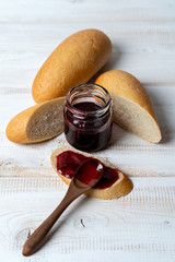 pieces wheat mini baguette with homemade jam. Sweet snack.