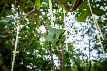 Floral arrangement at a wedding ceremony on beach.