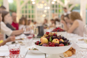 White bowl with fruit on festive table