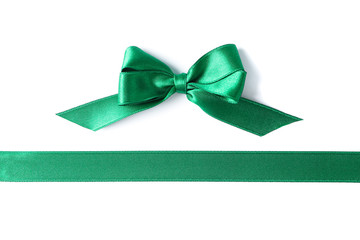 Green ribbon and bow isolated on white background. Gift concept