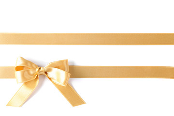 Golden ribbons with bow isolated on white background. Gift concept