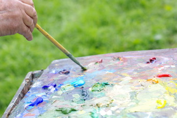 Drawing with oil paints on the nature. Palette