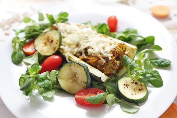  Zucchini stuffed with green lentils and vegetables. Casserole. A healthy vegetarian diet