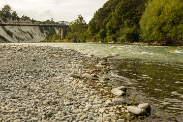 Low level shot of a fast flowing shallow Rangitikei River in New Zealand