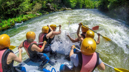 adventure team doing rafting on the cold waters of the Nestos River in Paranesti. - obrazy, fototapety, plakaty