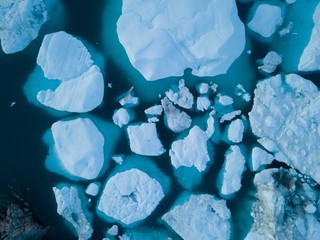 Icebergs drone aerial image top view - Climate Change and Global Warming. Icebergs from melting...