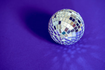 Sparkling disco ball in a day light. Concept of party.