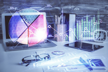 Multi exposure of chart and financial info and work space with computer background. Concept of...