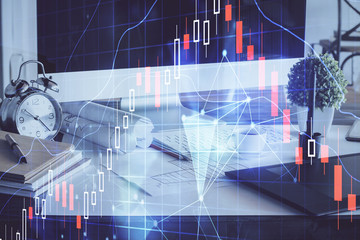 Forex market graph hologram and personal computer on background. Multi exposure. Concept of investment.
