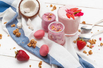 Composition with healthy food. Strawberries and yoghurt breakfast on table