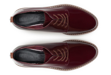 Classic male leather shoes isolated on a white, top view.